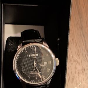 Tissot Classic Black and Silver Timepiece